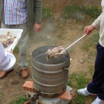 Neighbour cooking whole sheep head for us to enjoy!